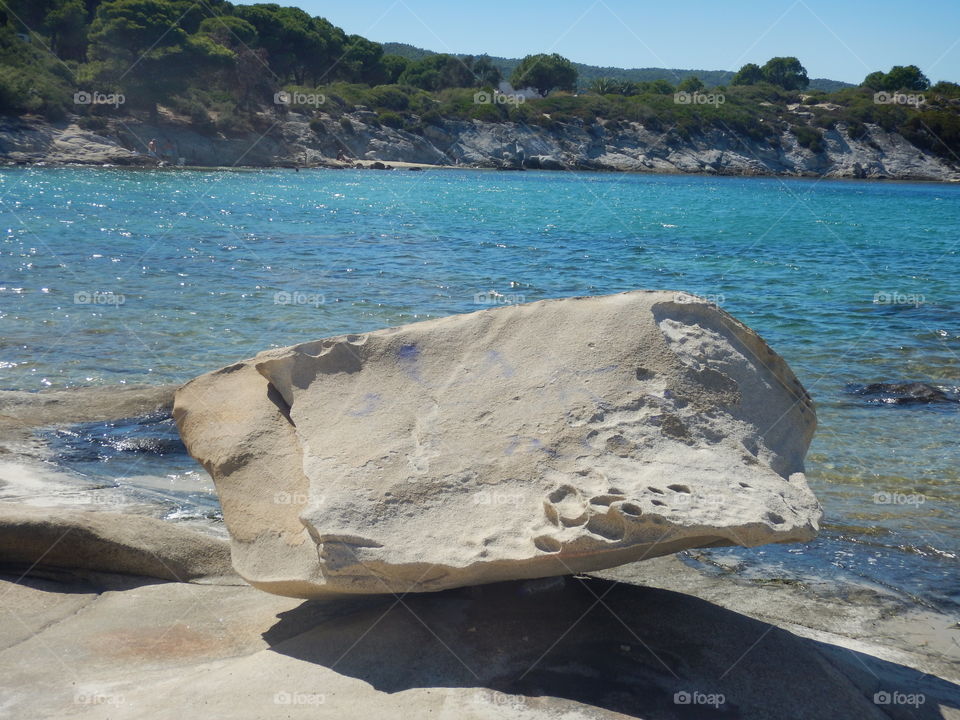big rock on the beach in sithoni,greece