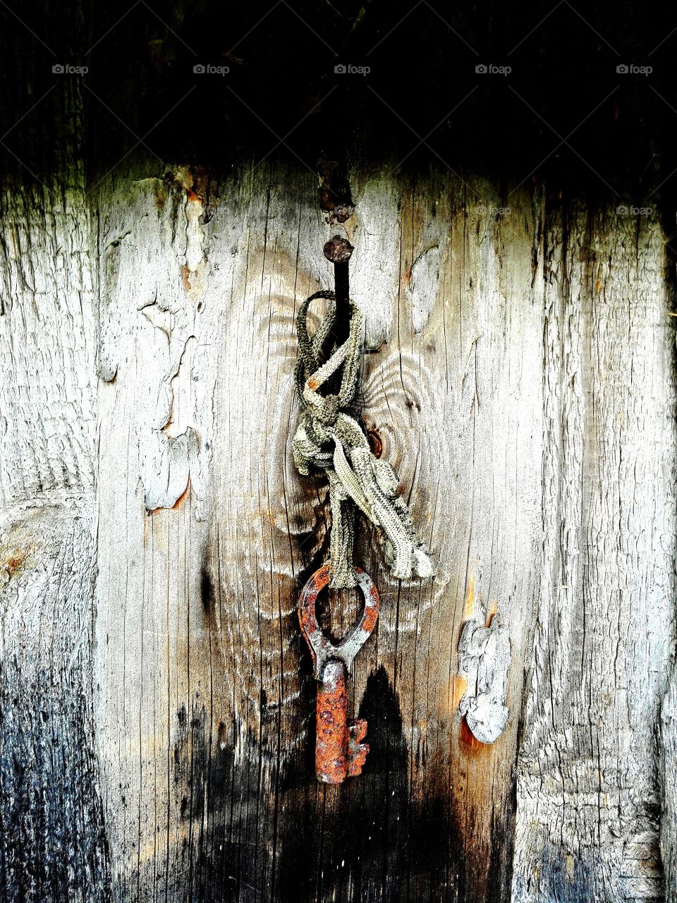Forgotten rusty key.