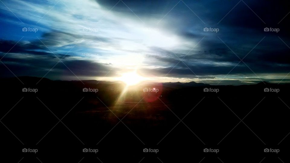 Sunset in Butte. As 8o'clock rolls around, the sun dips behind the mountains and creates a beautiful scene to behold.