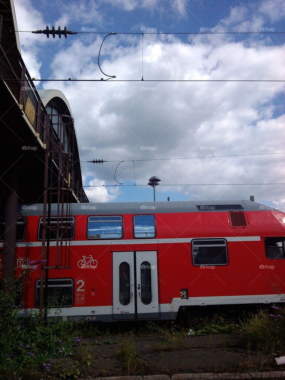 red train leaving station