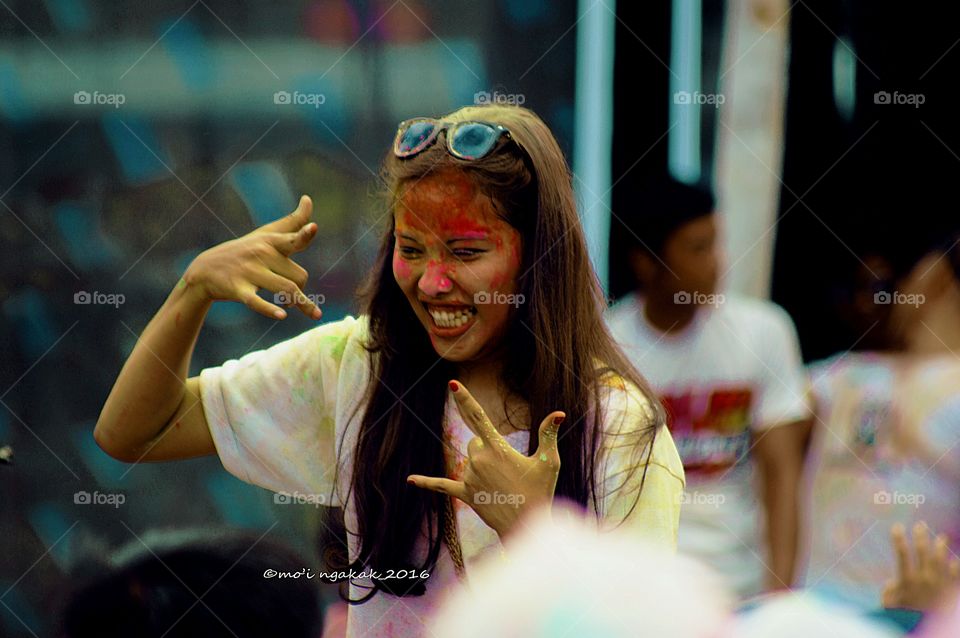 Woman enjoying color festival