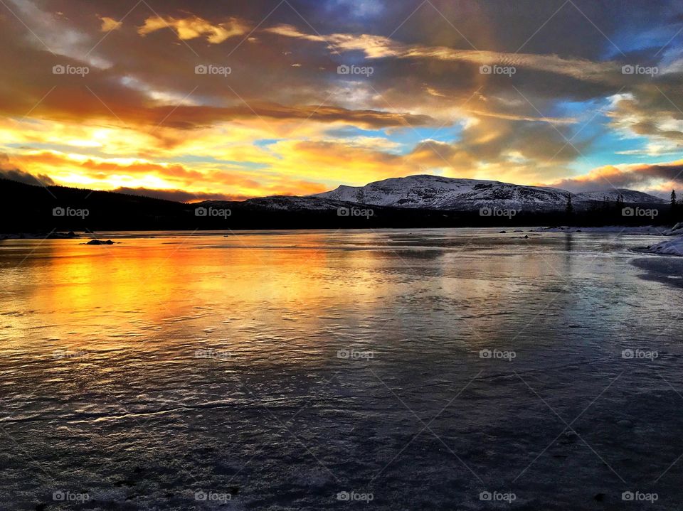 Sunset on winter lake 