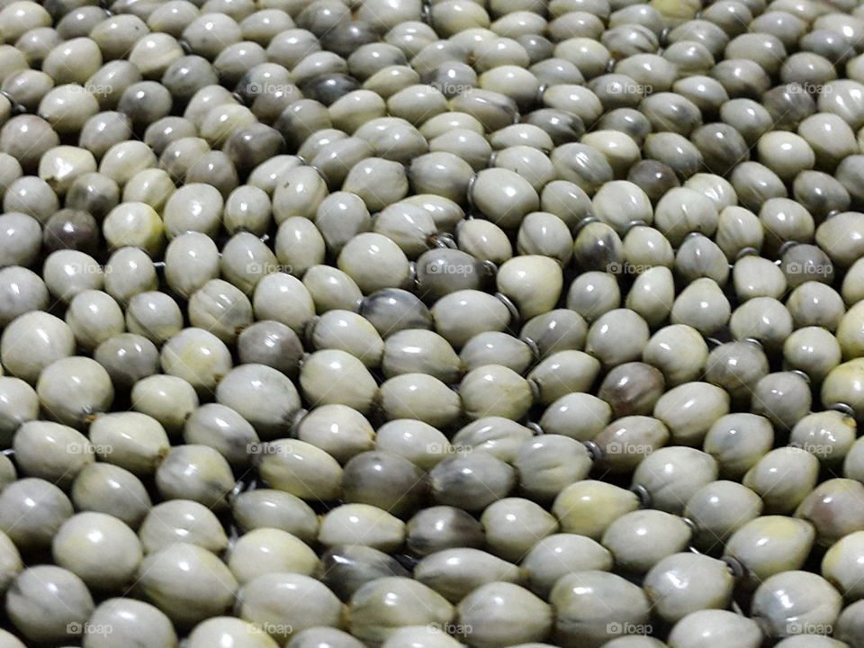 Mozambican 'teething seeds' woven together to create a beautiful circular placemat