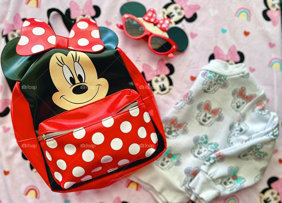 Toddler girl packs for vacation, Minnie Mouse loving toddler packs bag for vacation, going to Disney World with a toddler, Minnie Mouse travel essentials, traveling with toddlers 