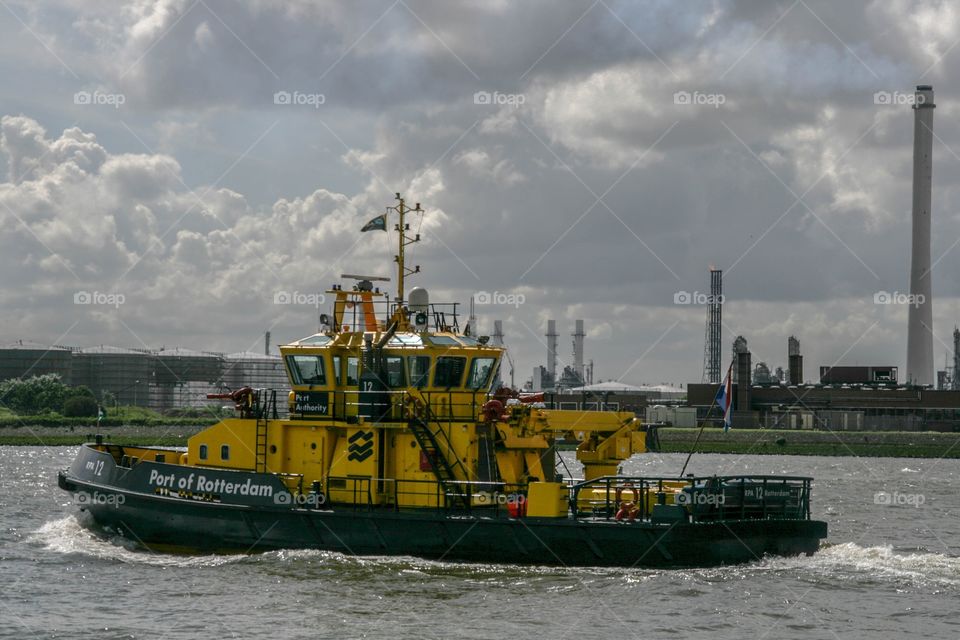 Yellow boat of port of Rotterdam 