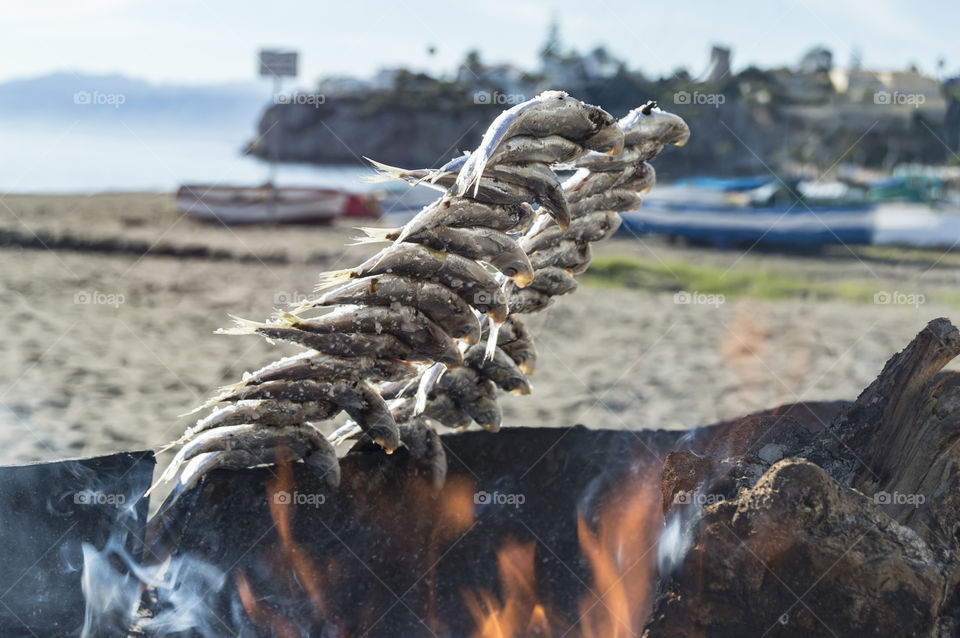 The espeto is a typical dish of the Malaga cuisine that consists of espetar, that is to say to skewer fish, traditionally sardines, in thin and long reeds, to roast it with firewood in the sand of the beach