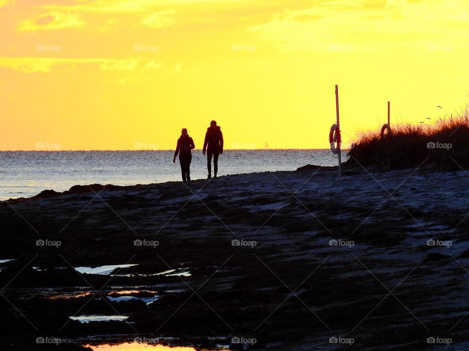 Silhouette in pale Winter sunset