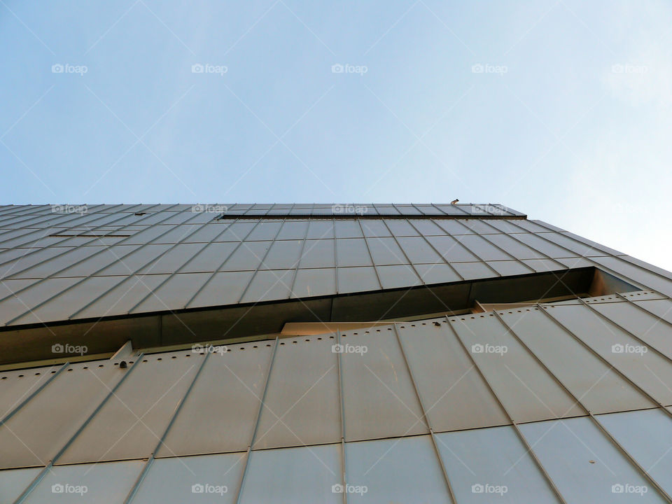 Low angle view of built structure of the Jewish Museum Berlin against clear sky.