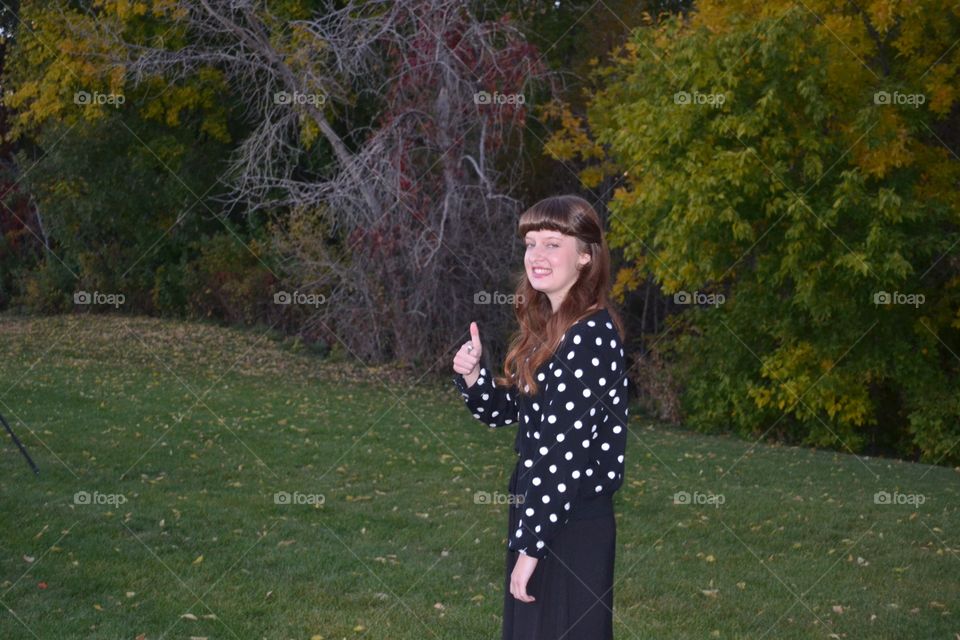 Woman gesturing in park