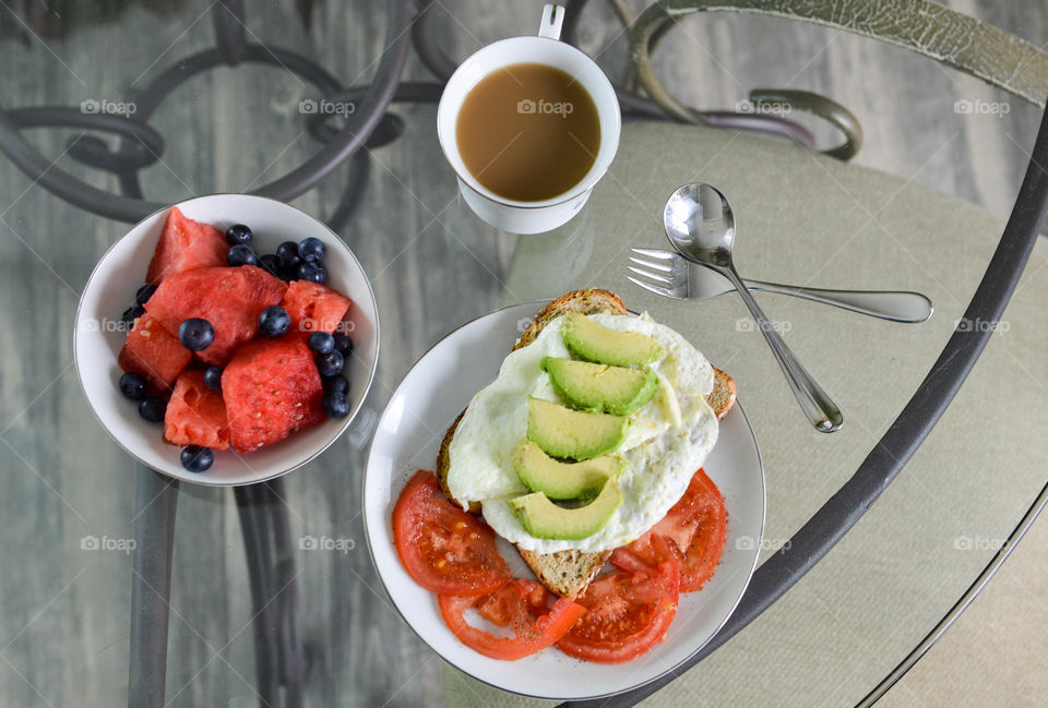 Healthy breakfast with coffee on table