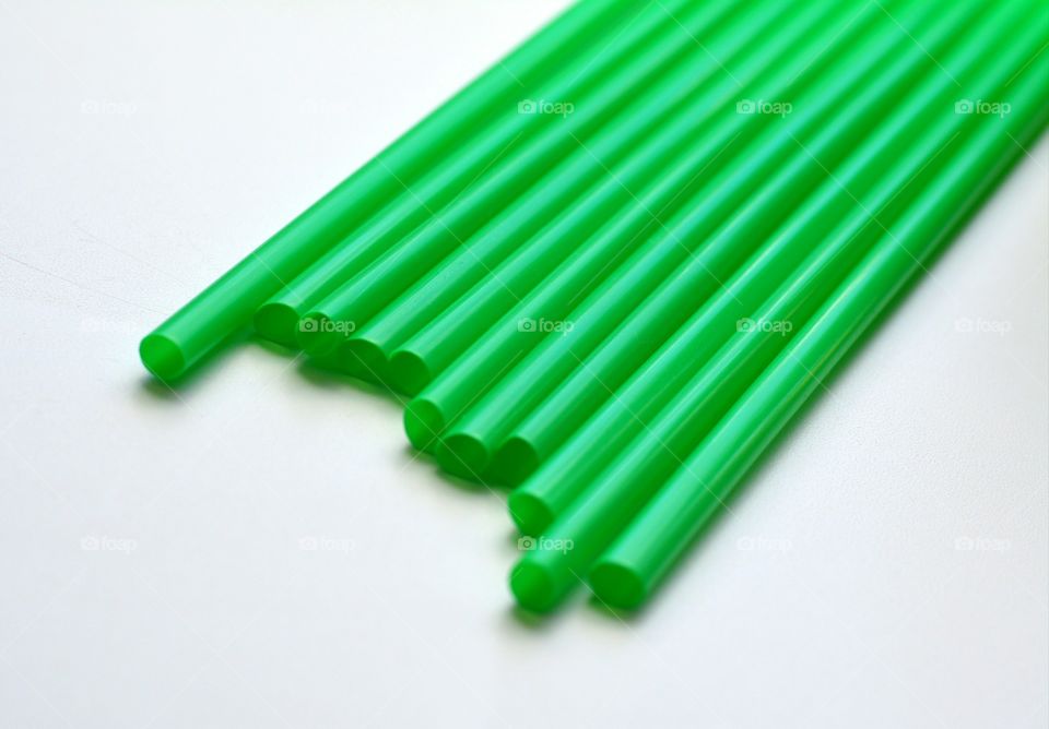 Green straw on whit background