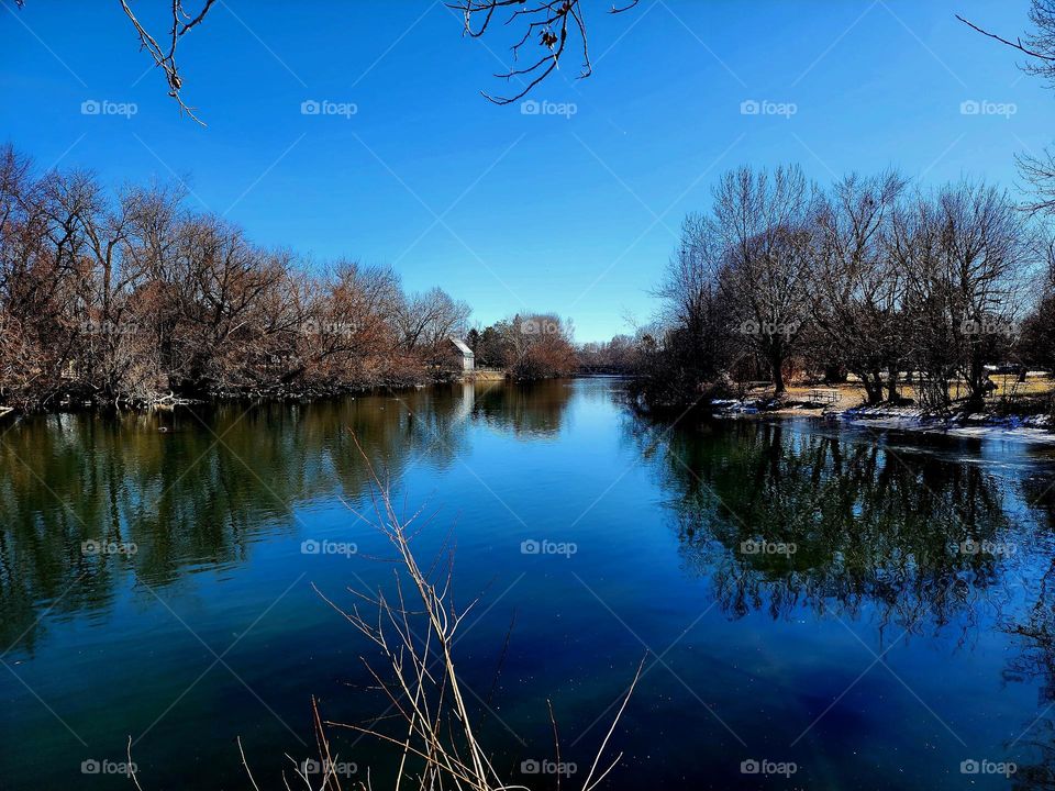 The Boise River runs through downtown Boise Idaho and features a long walking path and several pedestrian bridges