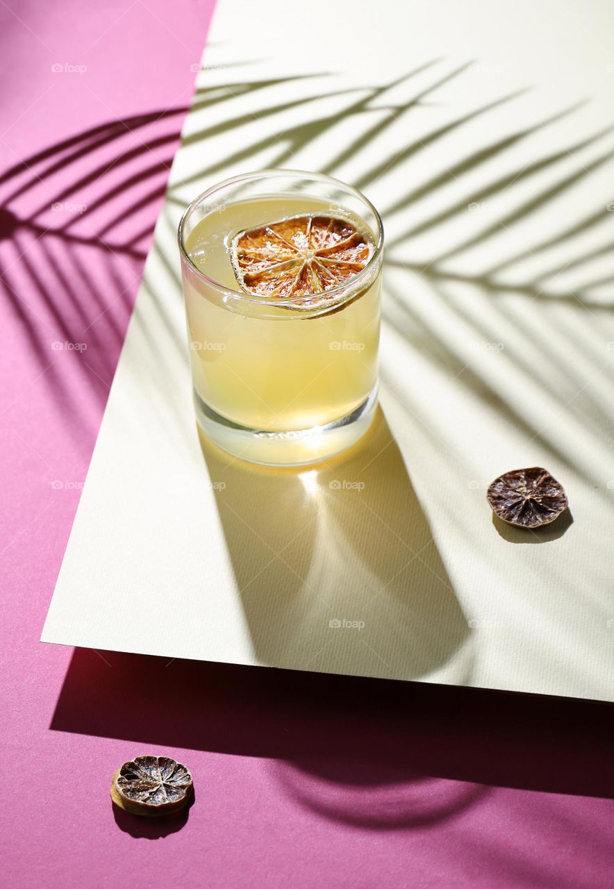 Super rich fragrant yellow cocktail with lemon