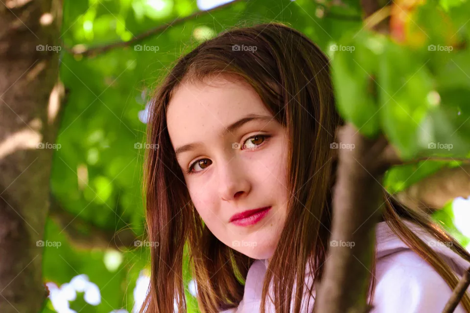 brown eyed girl in tree