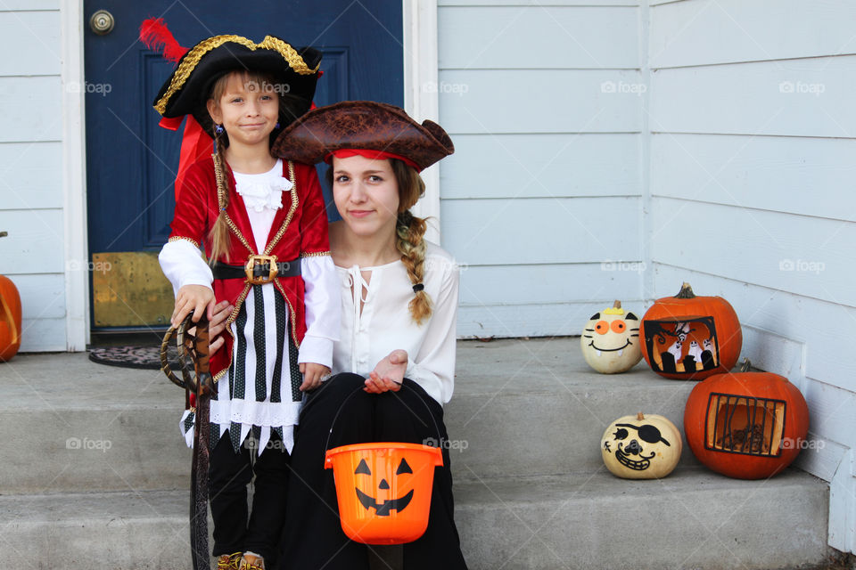 Sisters dressed up as pirates for Halloween