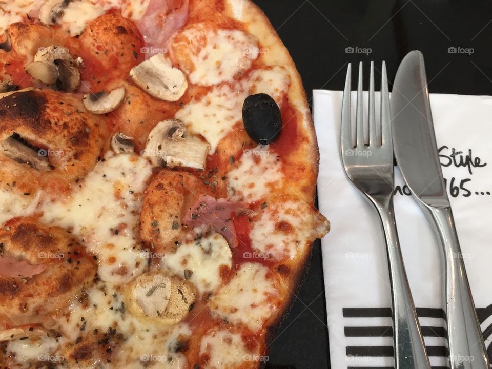 Pizza with knife and fork 