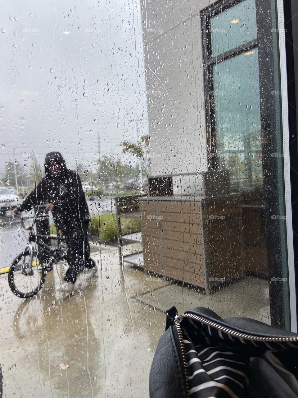 A man rides his bicycle outside a local Panera Bread restaurant on a recent rainy day. In NJ we were fortunate to only be getting much-needed rain, remnants of Hurricane Ian, which devastated Florida and South Carolina this week. Feeling grateful.