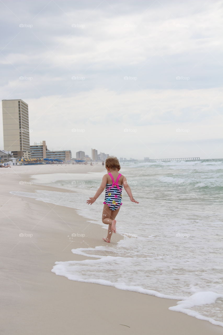 girl running at the beach. florida