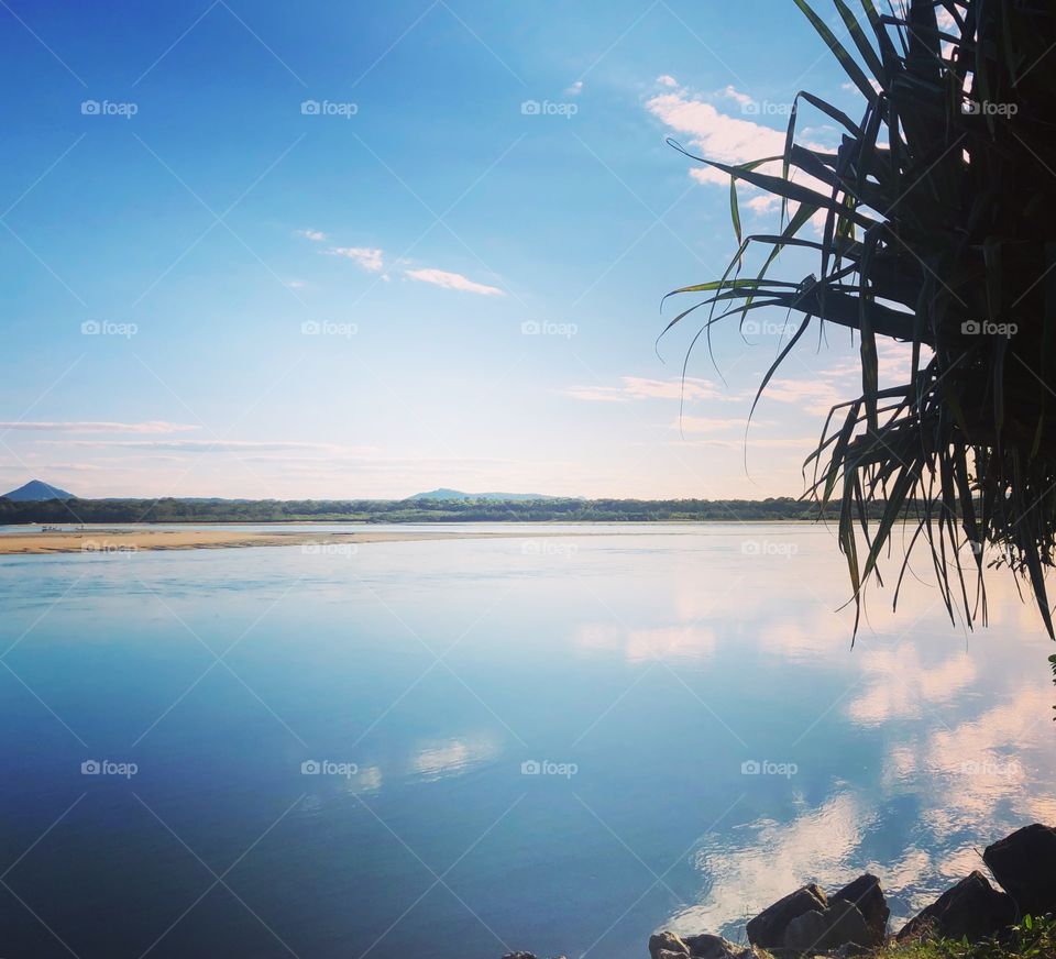Reflections in blue on the river