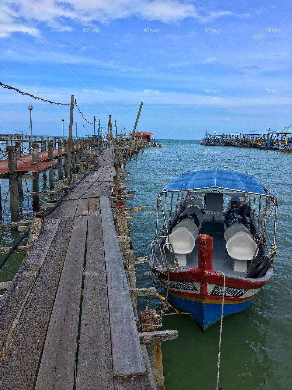 Tour boat moored at jetty, Penang Marine Park, Malaysia