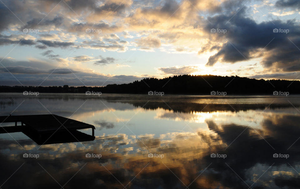 Dramatic sky reflecting on water