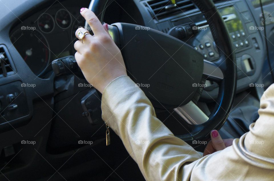 A girl rides in a car on the road