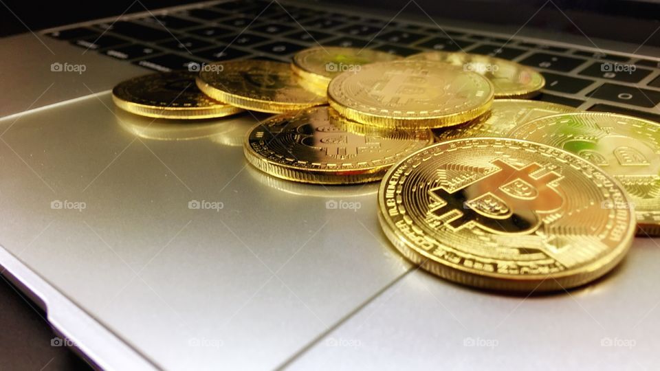 Close up on Gold bitcoin on keyboard 