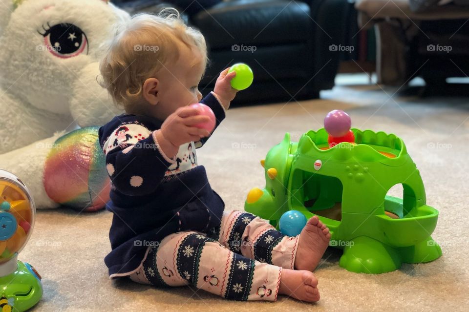 Completely amused with her new toys. 