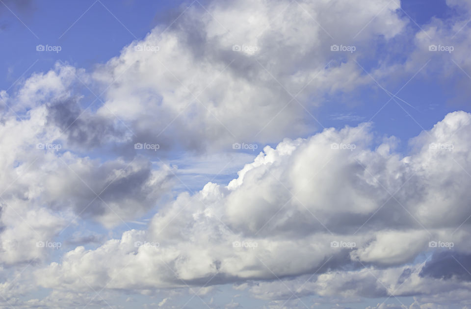 The beauty of the sky with clouds and the sun.