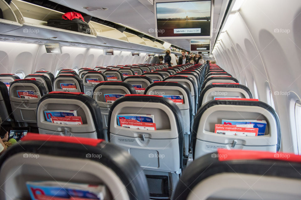 Empty airplan with empty seats on a Norwegian flight.