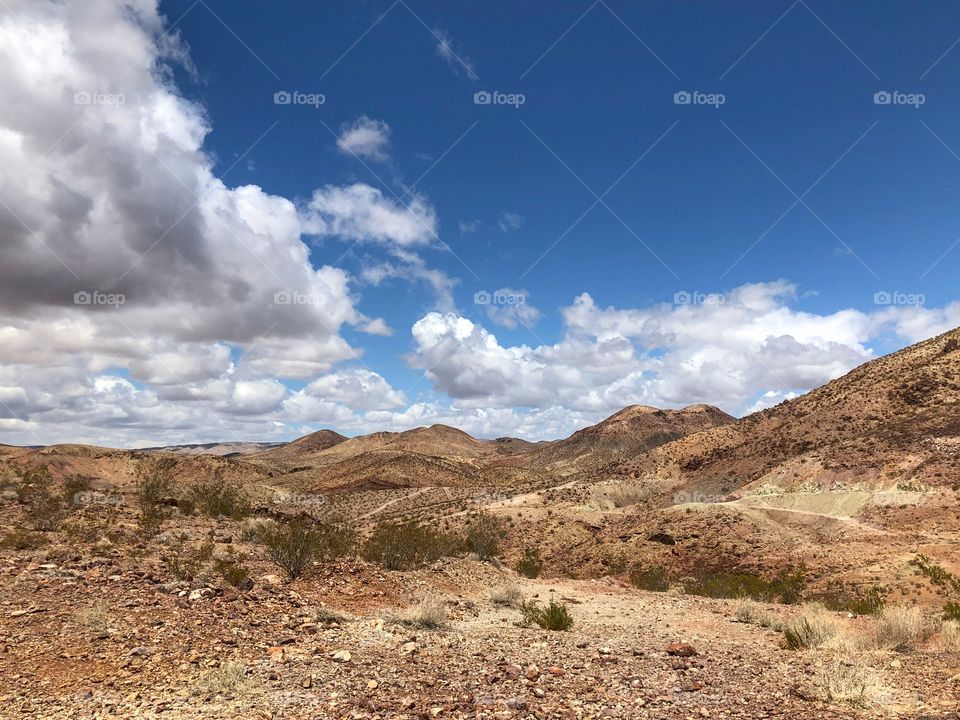 Dry rolling hills with popcorn type clouds