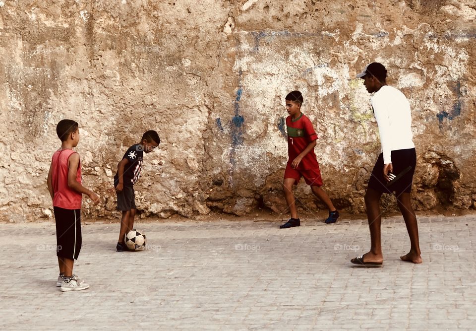 Kids playing football 