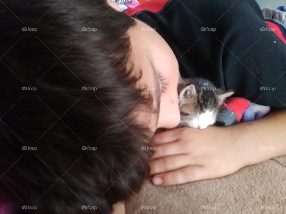 sleeping kitten and son