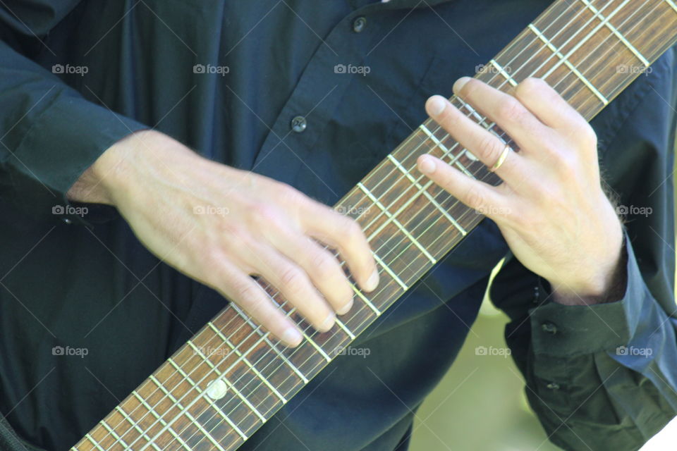 Close-up of men playing guitar