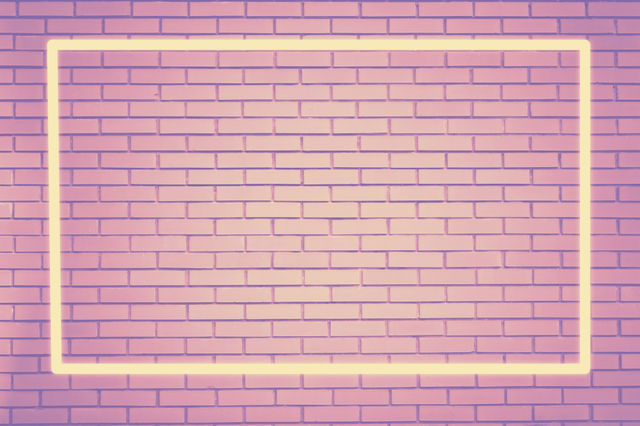 Glowing bright frame, pink vintage brick wall with space for text 