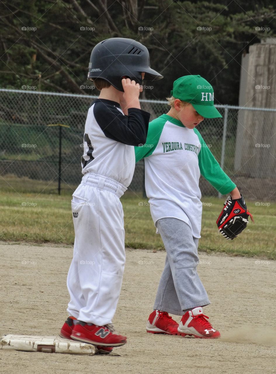 Young Baseball Players. Two Young Boys Playing American Little League Baseball
