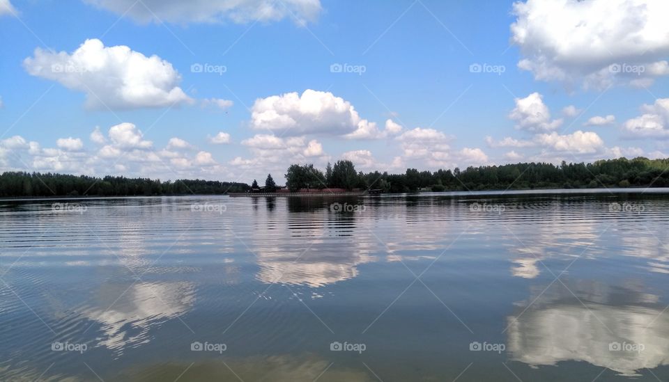 lake summer landscape and sky clouds reflection