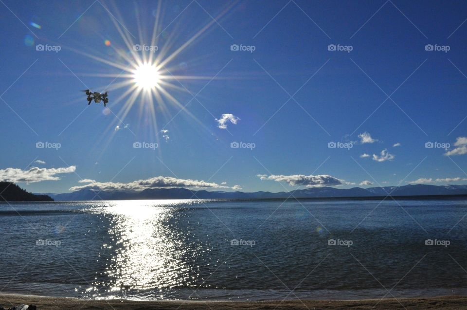 Flying drone over the lake