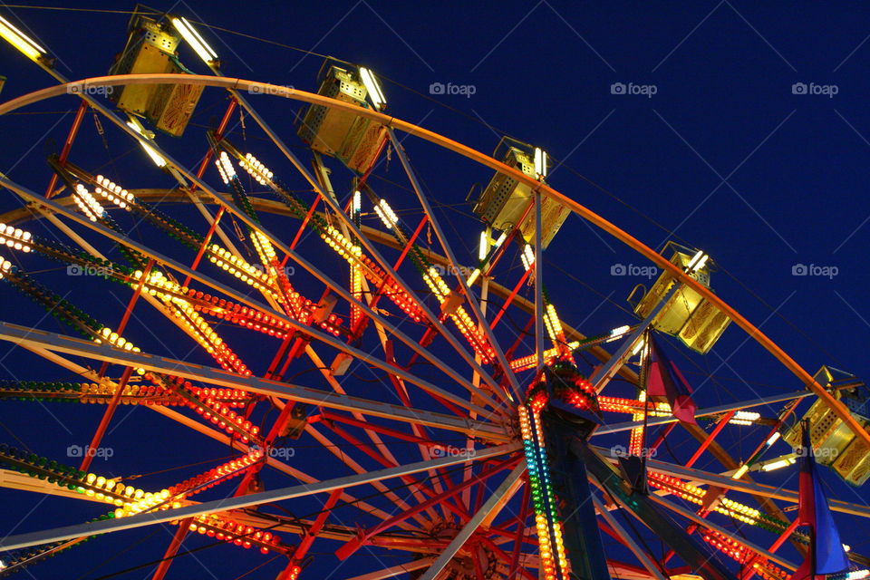 Close-up illuminated ferris wheel