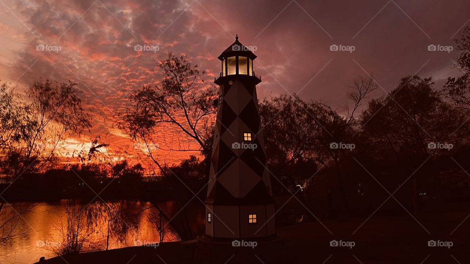 Darkness is now a mere few minutes away the clouds are cooling. The lighthouse stands firm it will be beautiful through the night. Even though the will not cool directly.