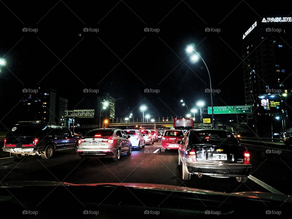 Night time with heavy traffic leaving town towards the suburbs