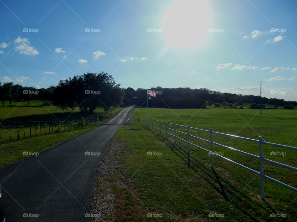 ranch road entrance. this is a picture of the entrance to a farm ranch that I saw on my way to possum kingdom lake