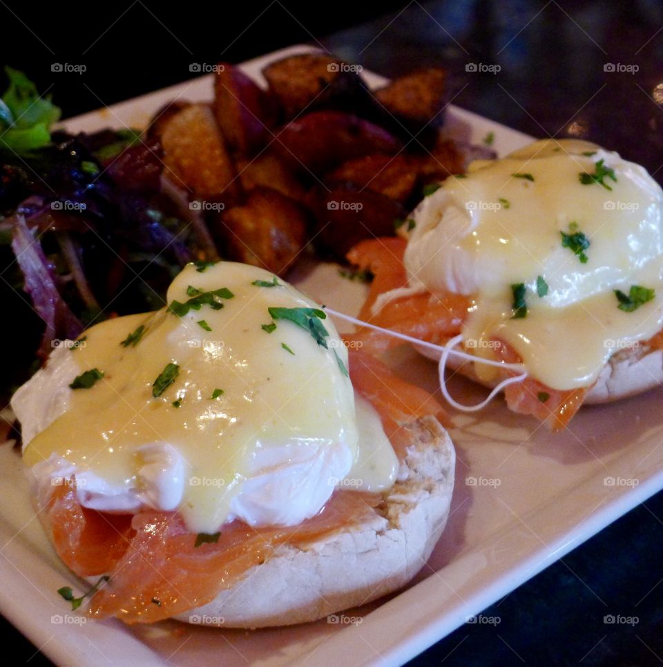 Delicious eggs Benedict with smoked salmon for your perfect weekend brunch,photo taken in Simone Martini Bar in NYC 