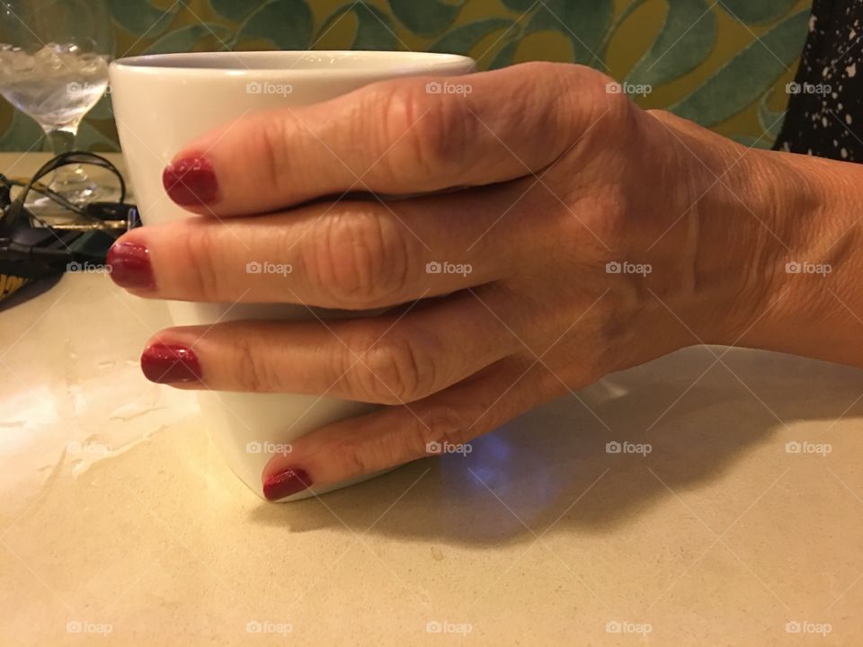 Hand holding coffee cup 1