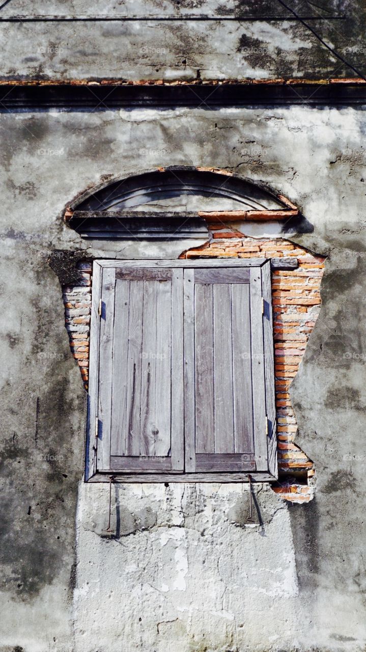 Ancient wall and window  in Songkhla, Thailand