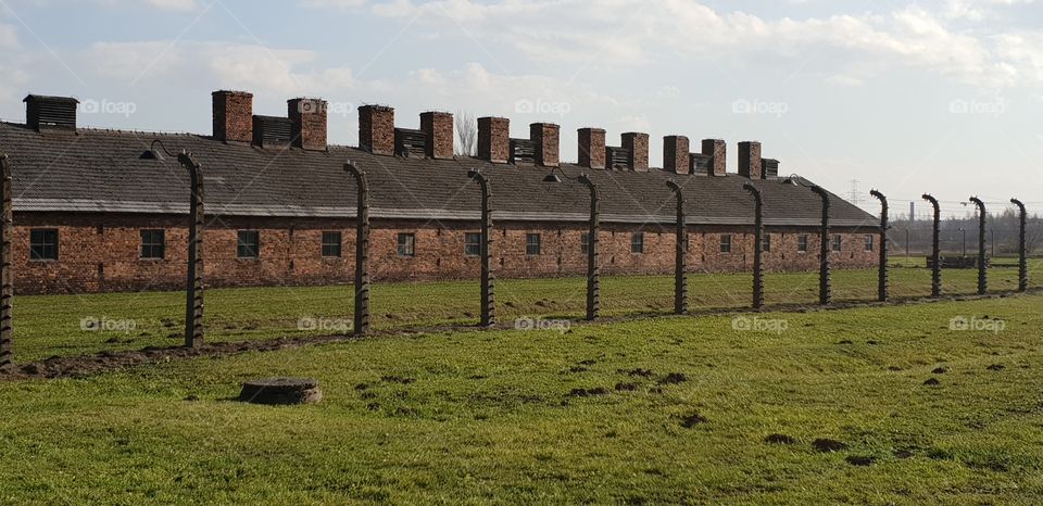 One of the many buildings at Aushwitz Birkenhau and prisoners camp fence