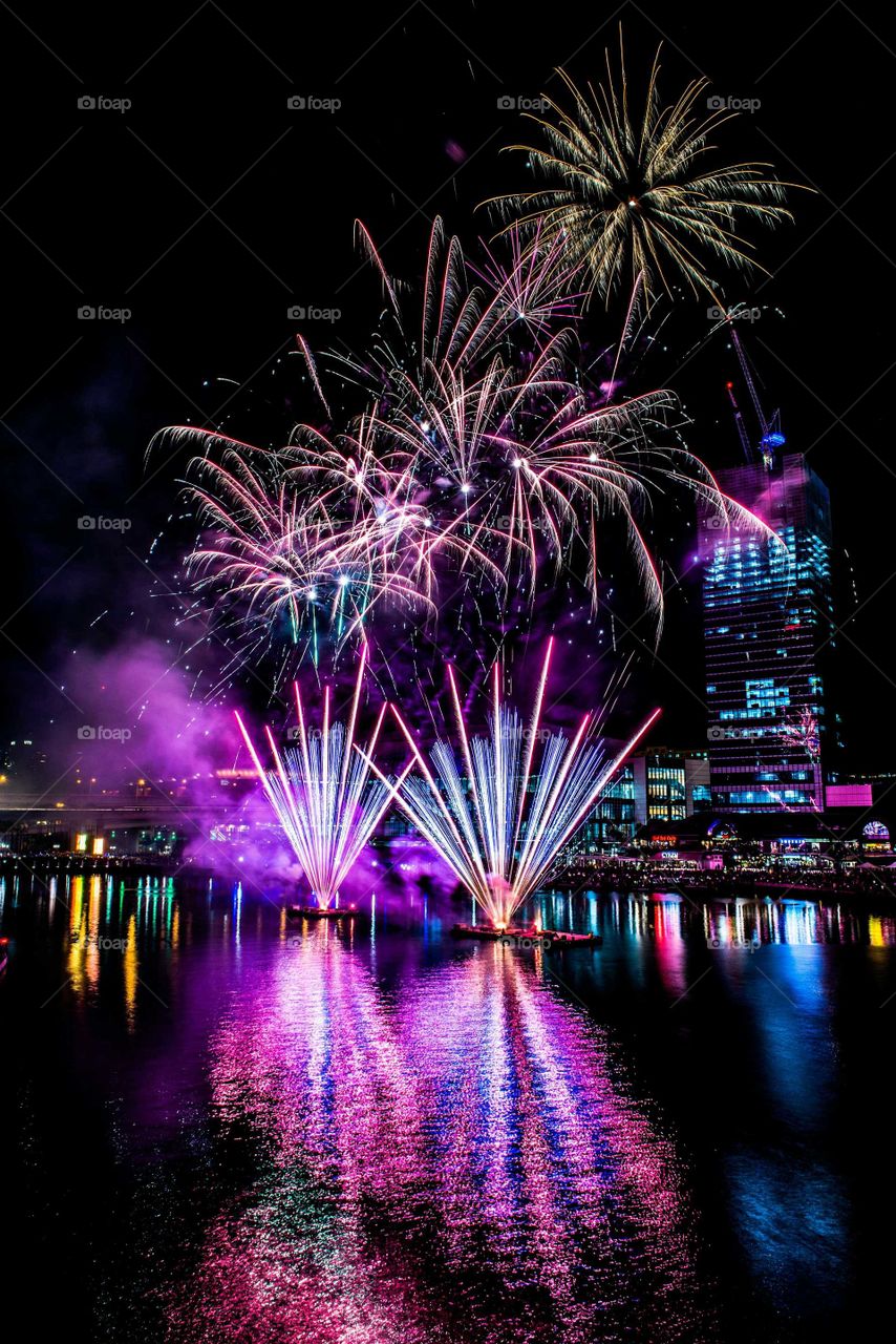 Close-up of colorful firework at night