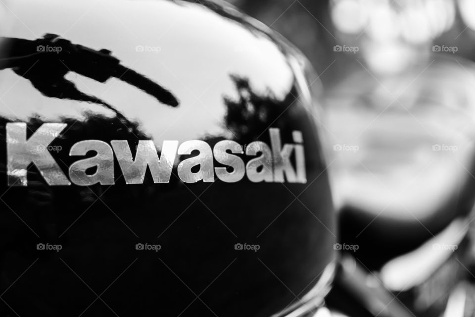 kawasaki logo on the motorcycle reservoir