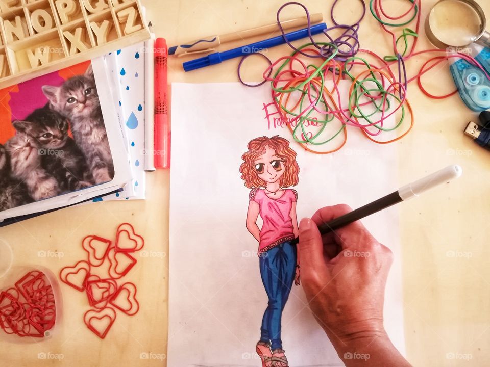 Girl draws and colors