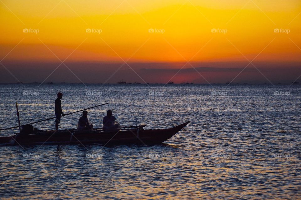 fishing during sunset